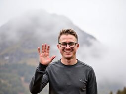 Outdoor casual portrait of Dr Connor Robertson with trees in background
