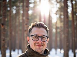 Outdoor candid headshot of Dr Connor Robertson with relaxed smile